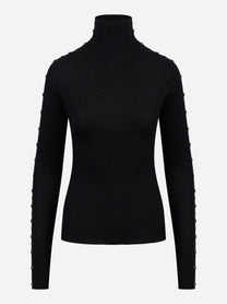 Dolcevita nero in lana merinos con applicazioni su maniche