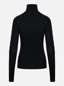 Dolcevita nero in lana merinos con applicazioni su maniche