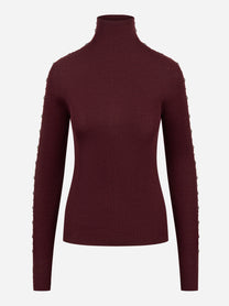 Dolcevita bordeaux in lana merinos con applicazioni su maniche