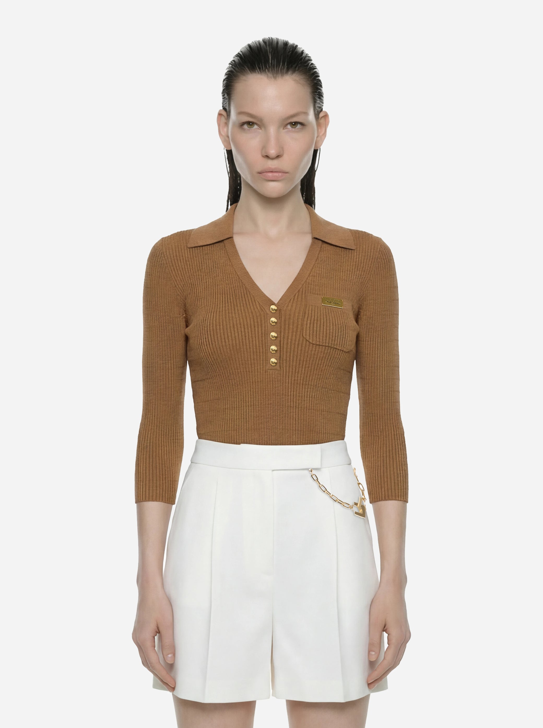 Polo beige in maglia a micro trecce