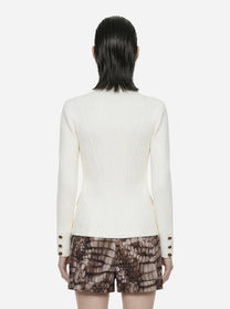 Giacca in maglia bianca con bottoni gioiello