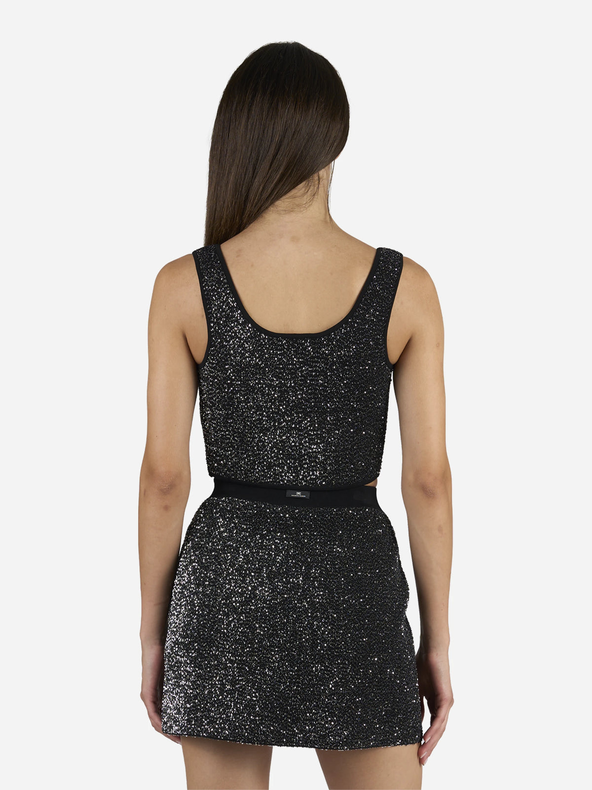 Top corto in maglia con paillettes nero - indossato, vista posteriore
